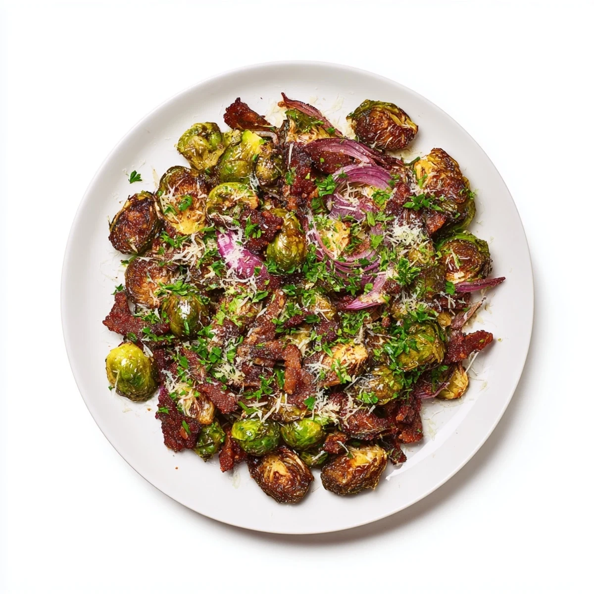 Golden roasted Brussels sprouts with crispy beef bacon, fresh parsley, and melted Parmesan on a white plate, served as a hearty American side dish.
