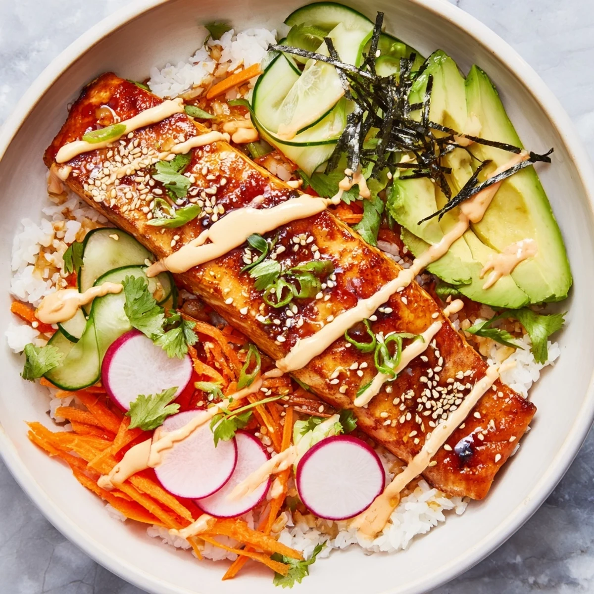 Flaky teriyaki-glazed salmon rests atop fluffy jasmine rice with crunchy pickled veggies in this vibrant bowl.