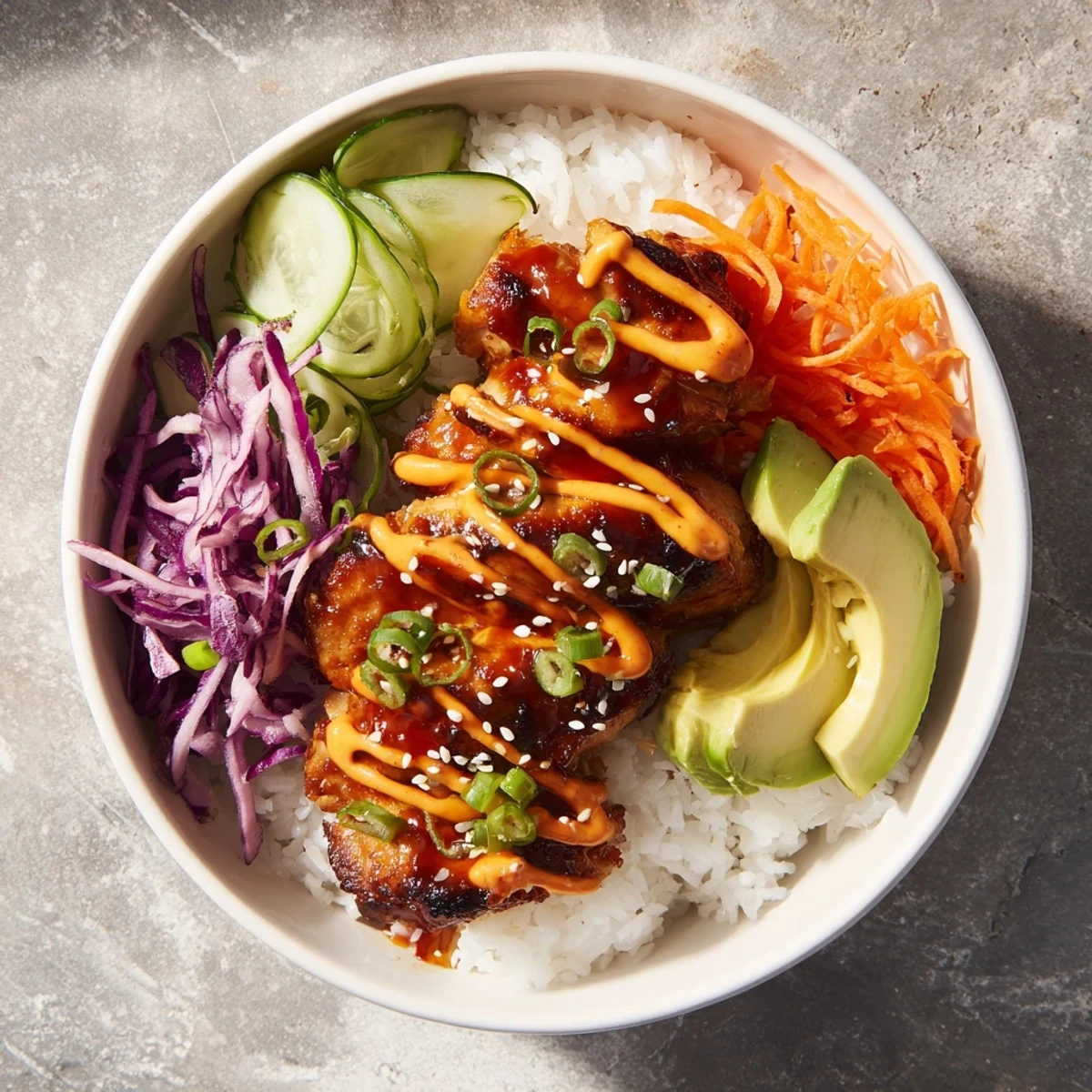 Golden grilled Korean BBQ chicken bowl with colorful vegetables and spicy gochujang mayo drizzle