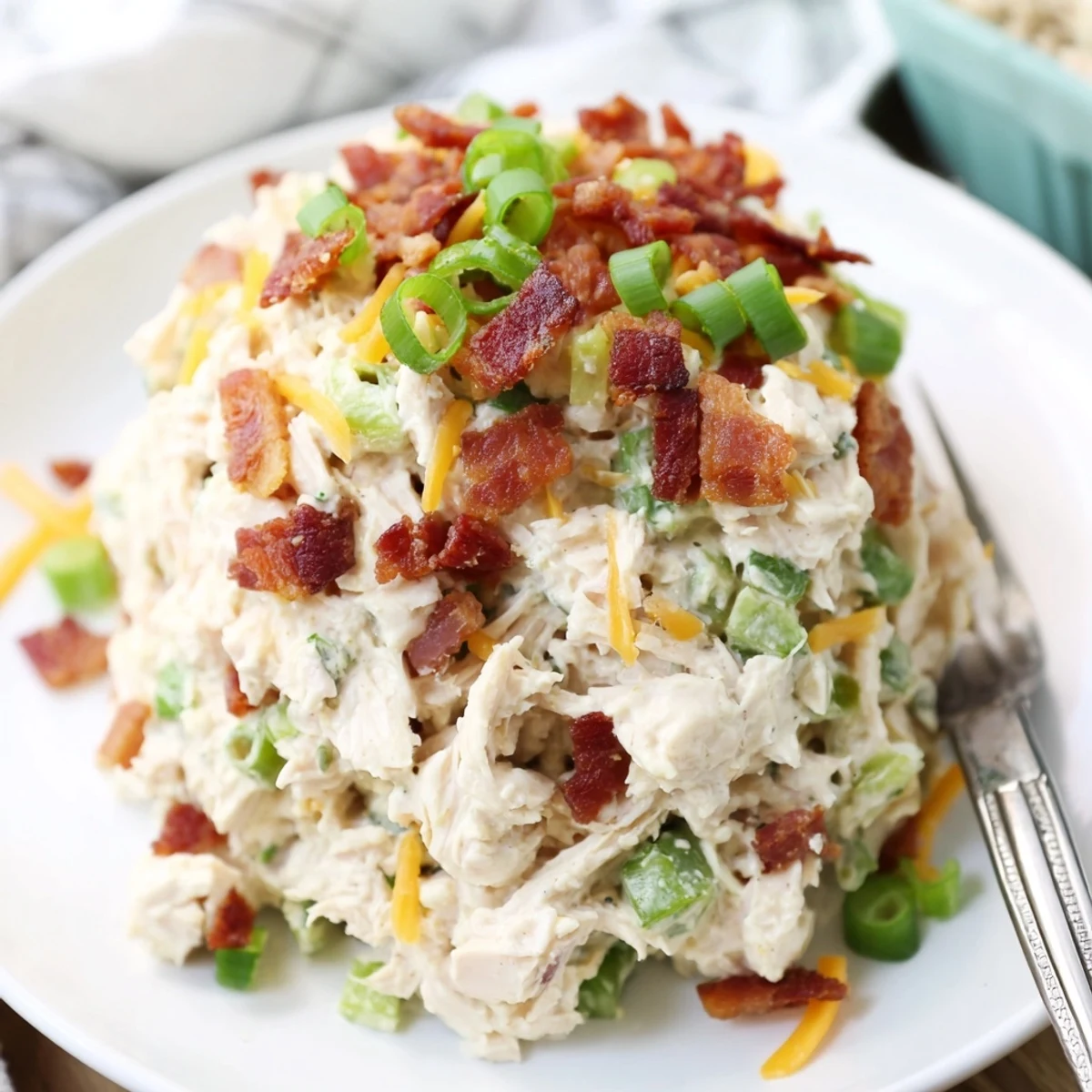 Keto-friendly jalapeno popper chicken salad served chilled with green onions and celery