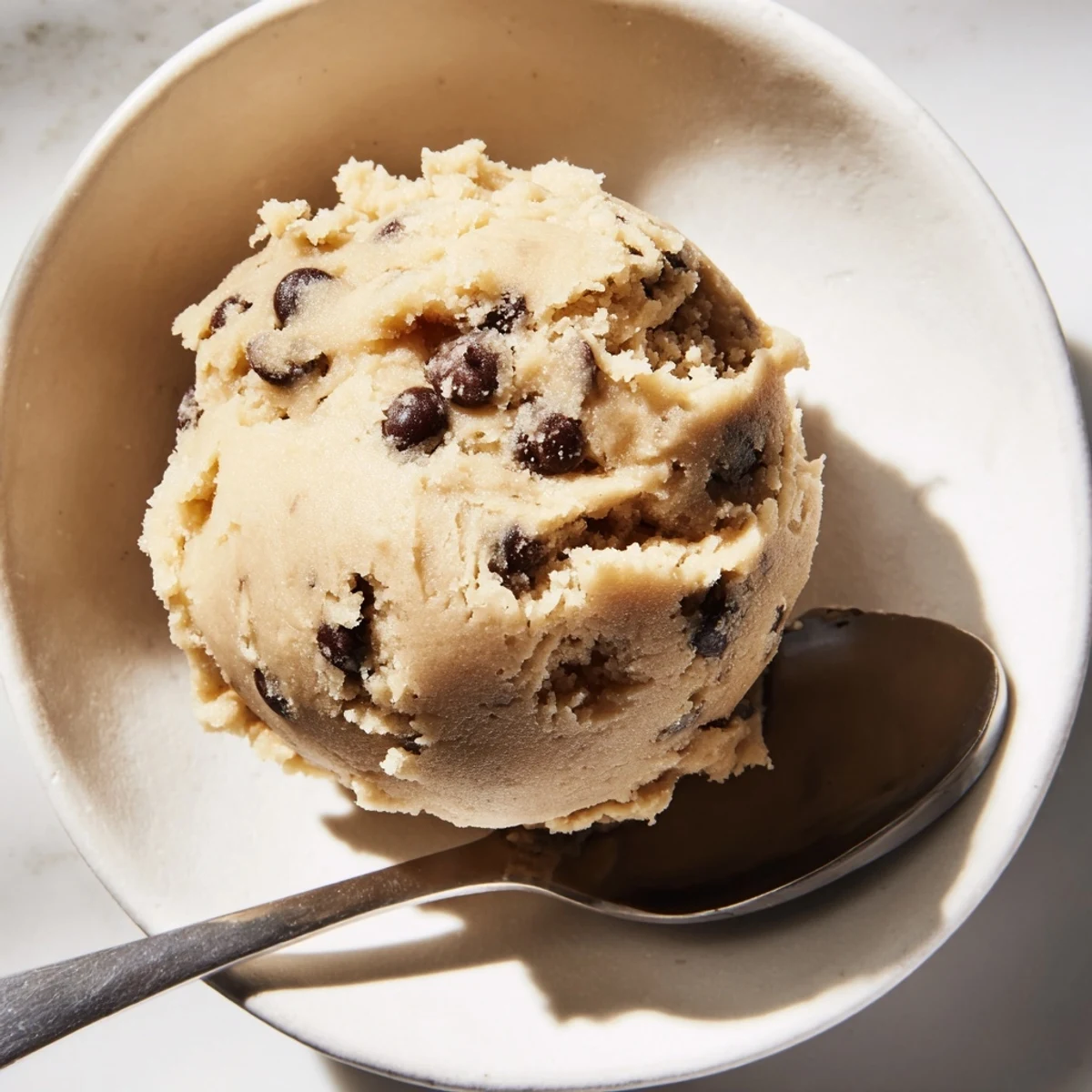 Edible chocolate chip cookie dough scooped into perfect bite-sized rounds for snacking