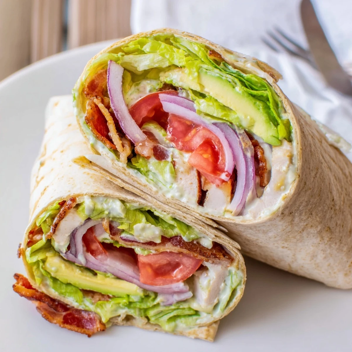 Meal Prep BLT Wraps with crispy bacon, juicy tomatoes, and creamy dressing