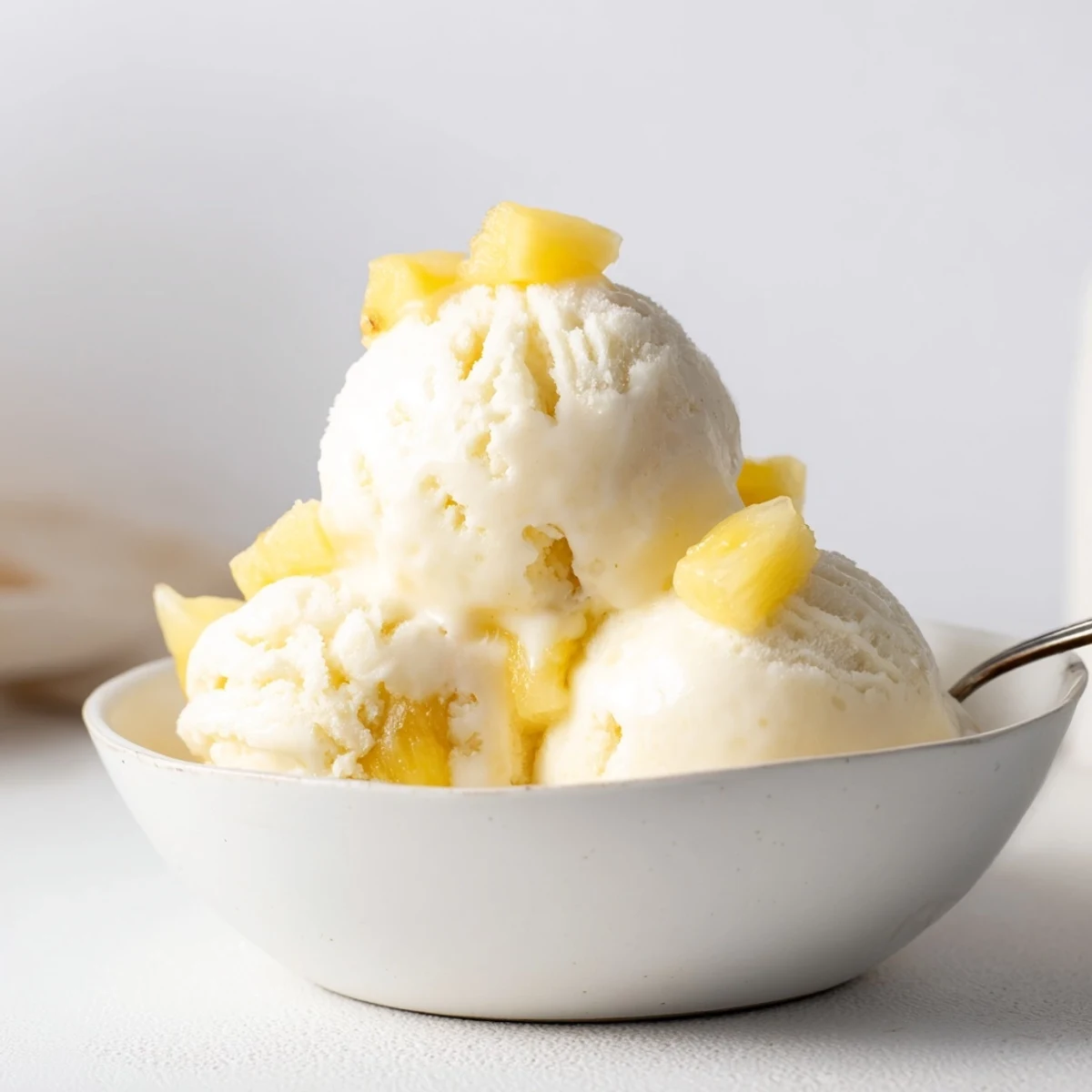 Homemade Creamy Pineapple Ice Cream Recipe churned until velvety, ready to serve