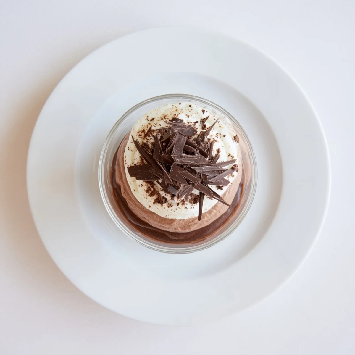Silky Triple Chocolate Mousse Cups topped with shaved chocolate, ready to serve.