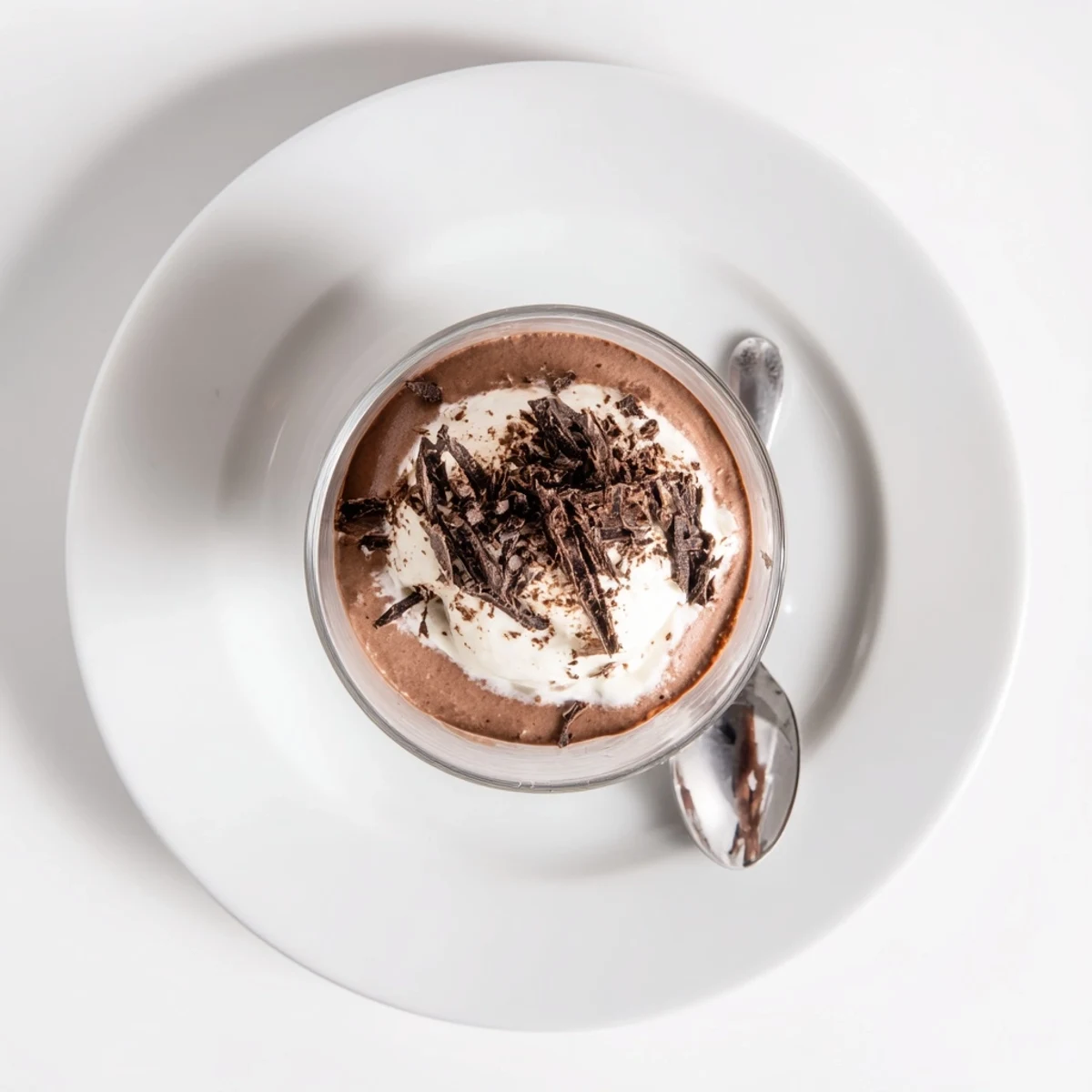 Close up of Triple Chocolate Mousse Cups in glasses, velvety mousse layers visible.