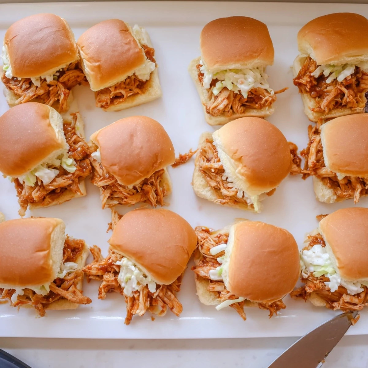 Tender smoked BBQ chicken piled onto soft golden Hawaiian sweet rolls for easy entertaining